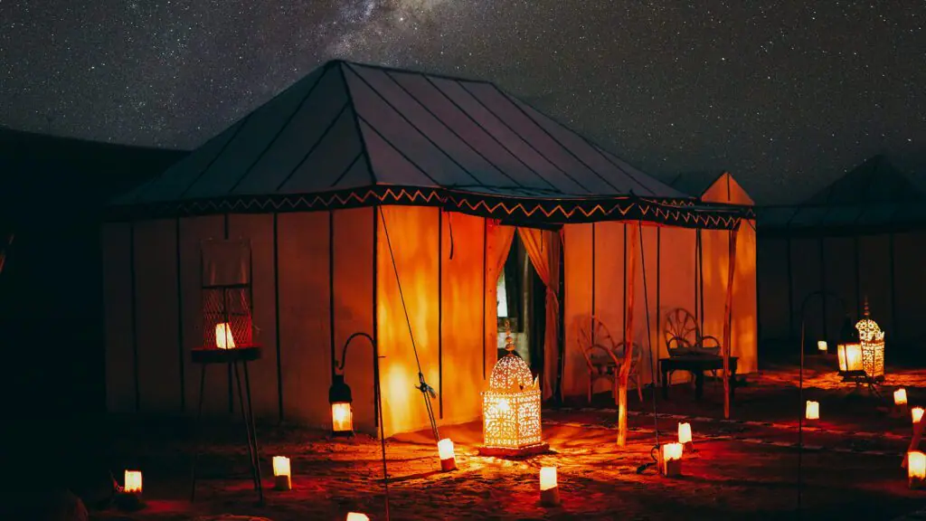 Lantern-lit Sahara camp on a three-day desert tour from Fes